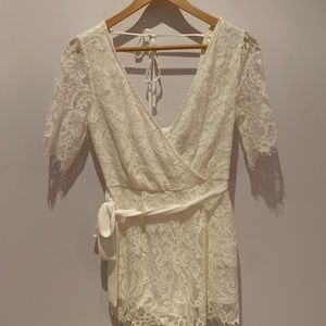 Beautiful white lace romper - worn 1x! XS, back zipper, tie back, & belt detail.